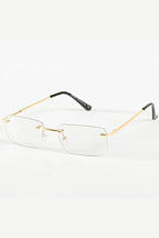 Randloze transparante zonnebril met goudkleurige pootjes - voorkant weergave